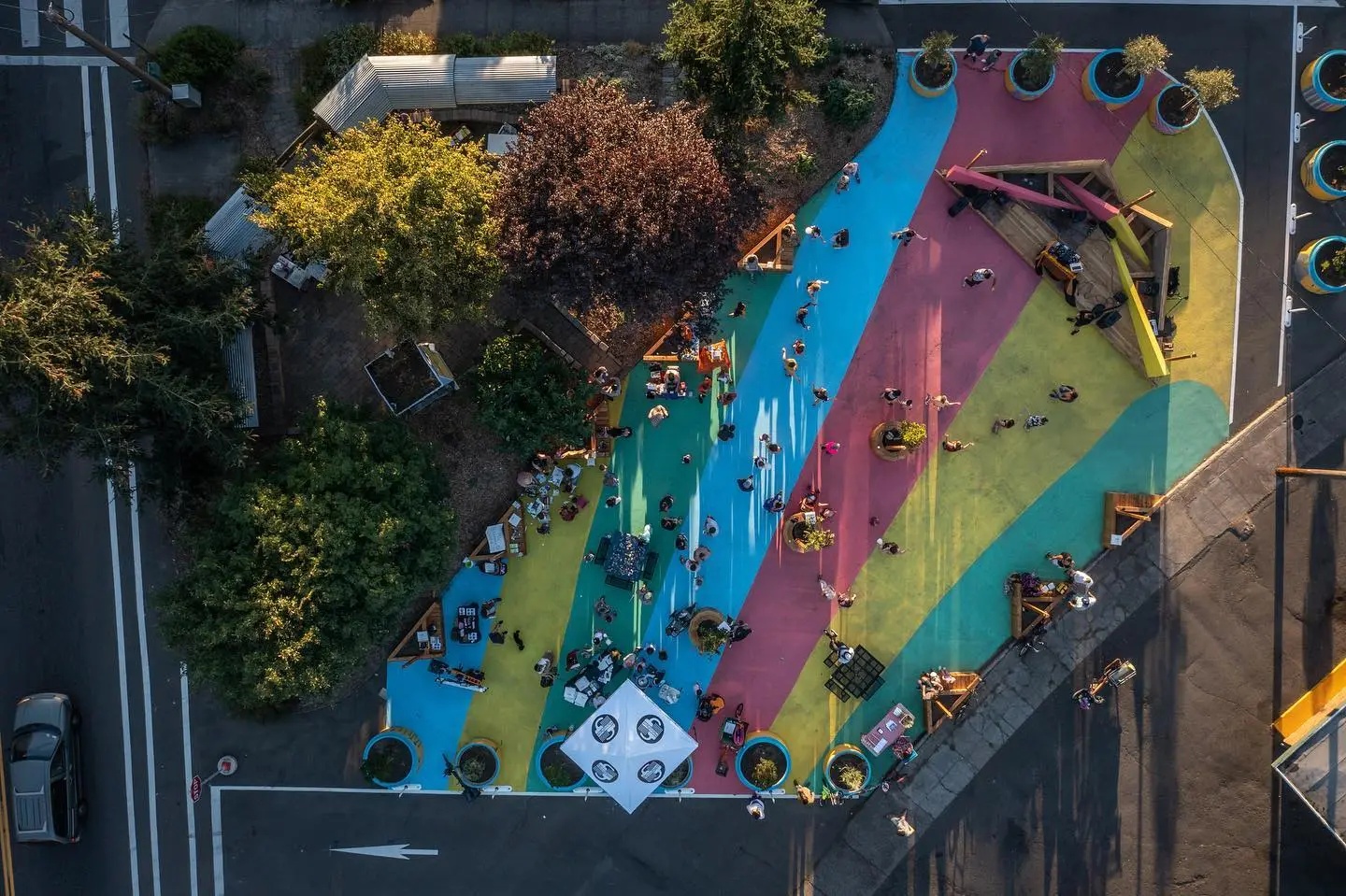 Aerial view of Arleta Triangle Square during a community event